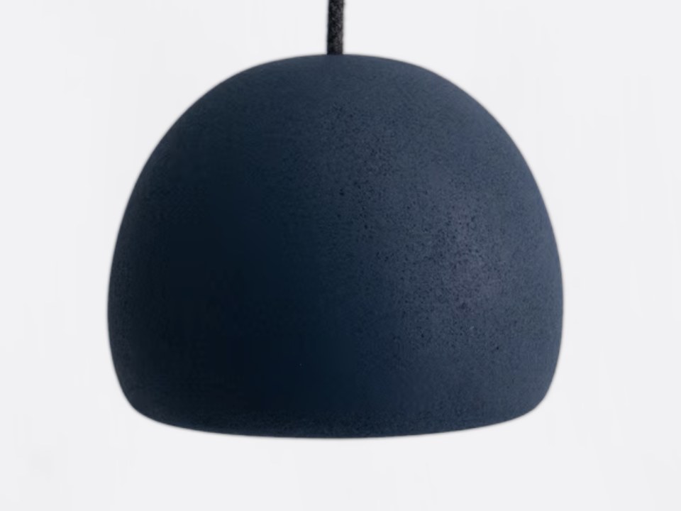 The blue Orb L lamp hanging from its cable.